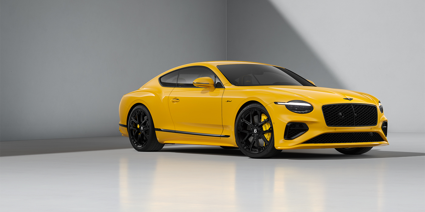 Emil Frey Exclusive Cars GmbH | Bentley München Bentley Continental GT Speed coupe in Monaco Yellow paint and 22" Ten spoke sport wheels - front 3/4