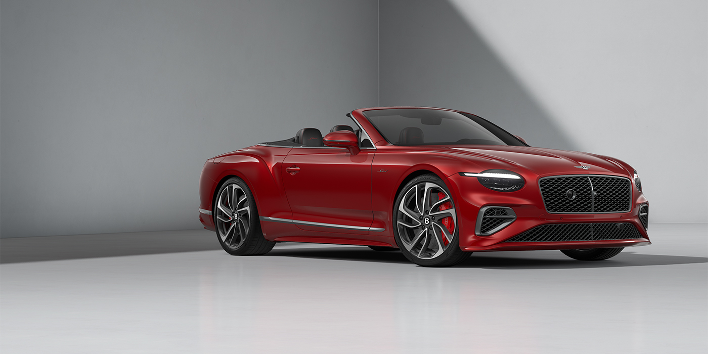 Emil Frey Exclusive Cars GmbH | Bentley München Bentley Continental GTC Speed convertible in Dragon Red paint and 22" swept spoke wheels - front 3/4