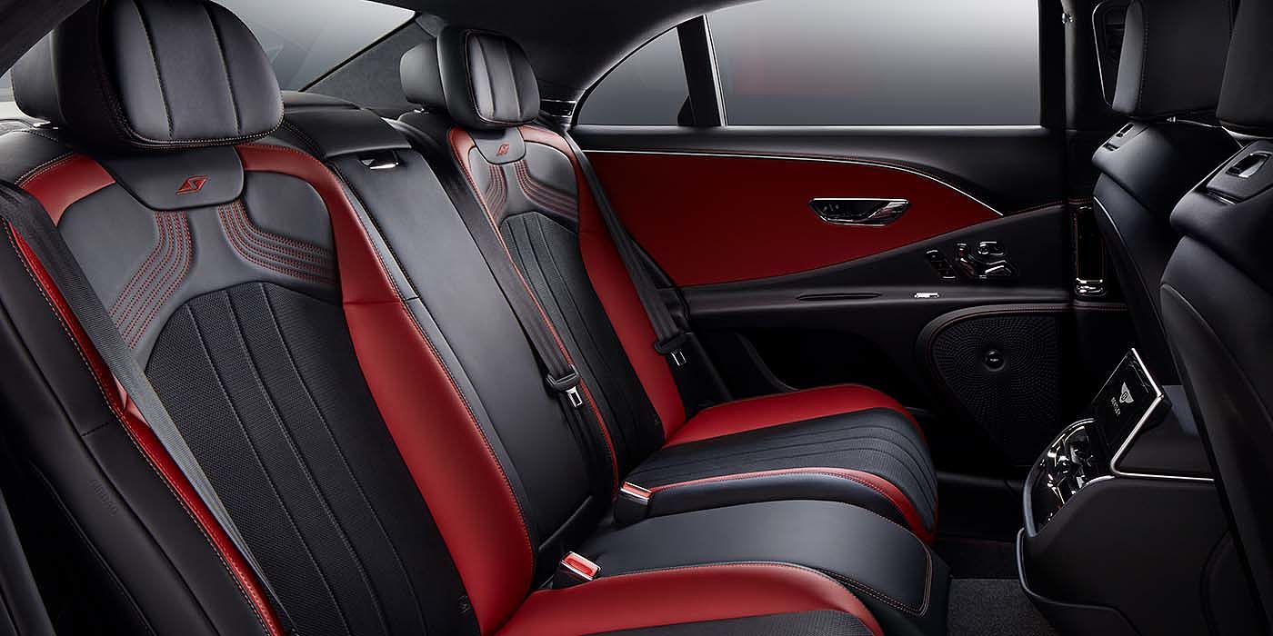 Emil Frey Exclusive Cars GmbH | Bentley München Bentley Flying Spur S sedan rear interior in Beluga black and Hotspur red hide with S stitching