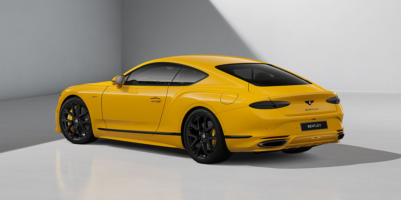 Emil Frey Exclusive Cars GmbH | Bentley München Bentley Continental GT Speed coupe in Monaco Yellow paint and 22" Ten spoke sport wheels - rear 3/4