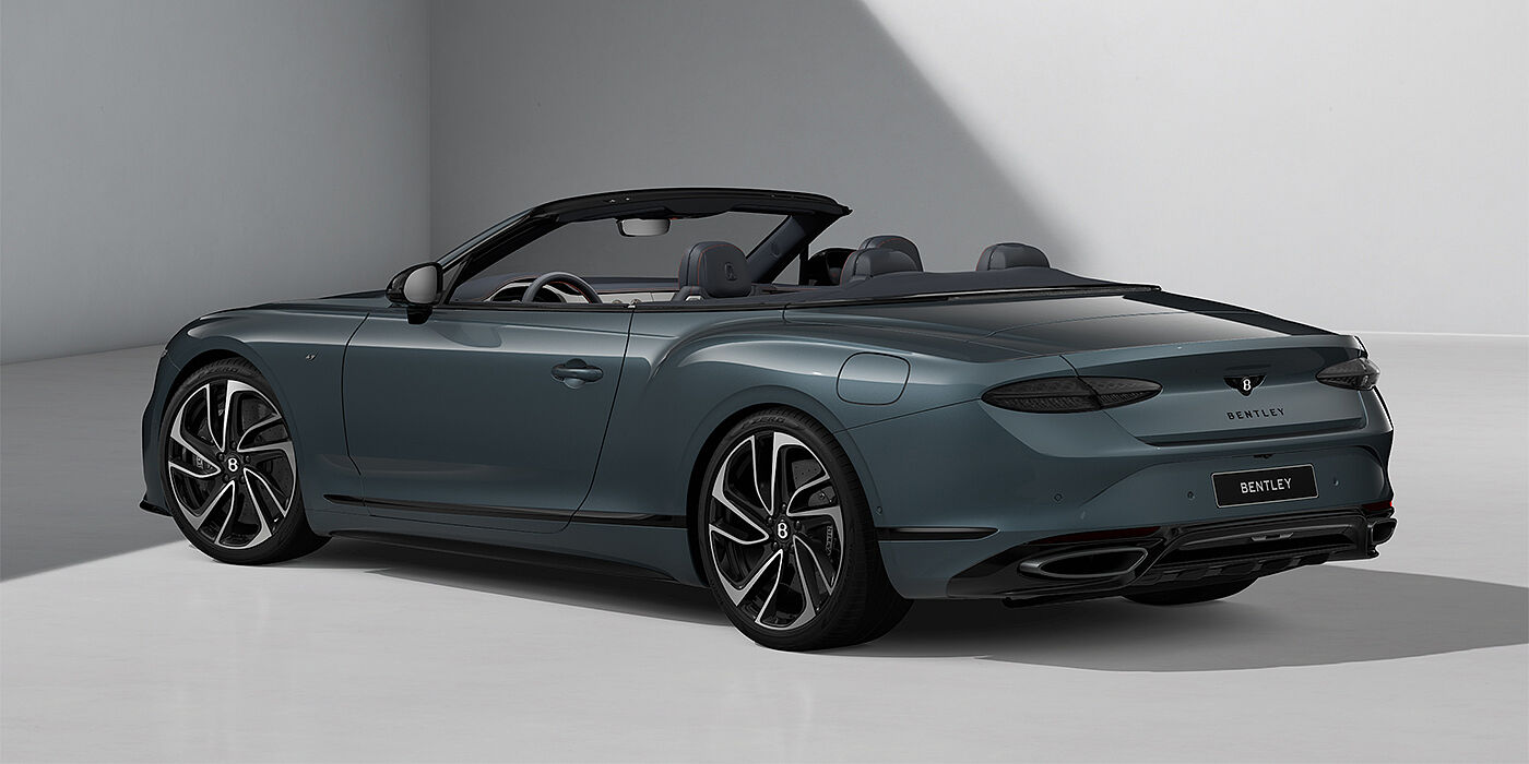 Emil Frey Exclusive Cars GmbH | Bentley München Bentley Continental GTC S convertible in Thunder blue paint and 22" ten spoke wheels rear 3/4