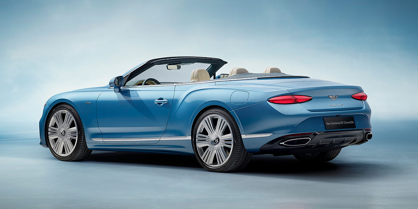 Emil Frey Exclusive Cars GmbH | Bentley München New Bentley Continental GTC Azure convertible rear view in Light Windsor blue paint with 22 inch ten spoke wheels and chrome exterior details