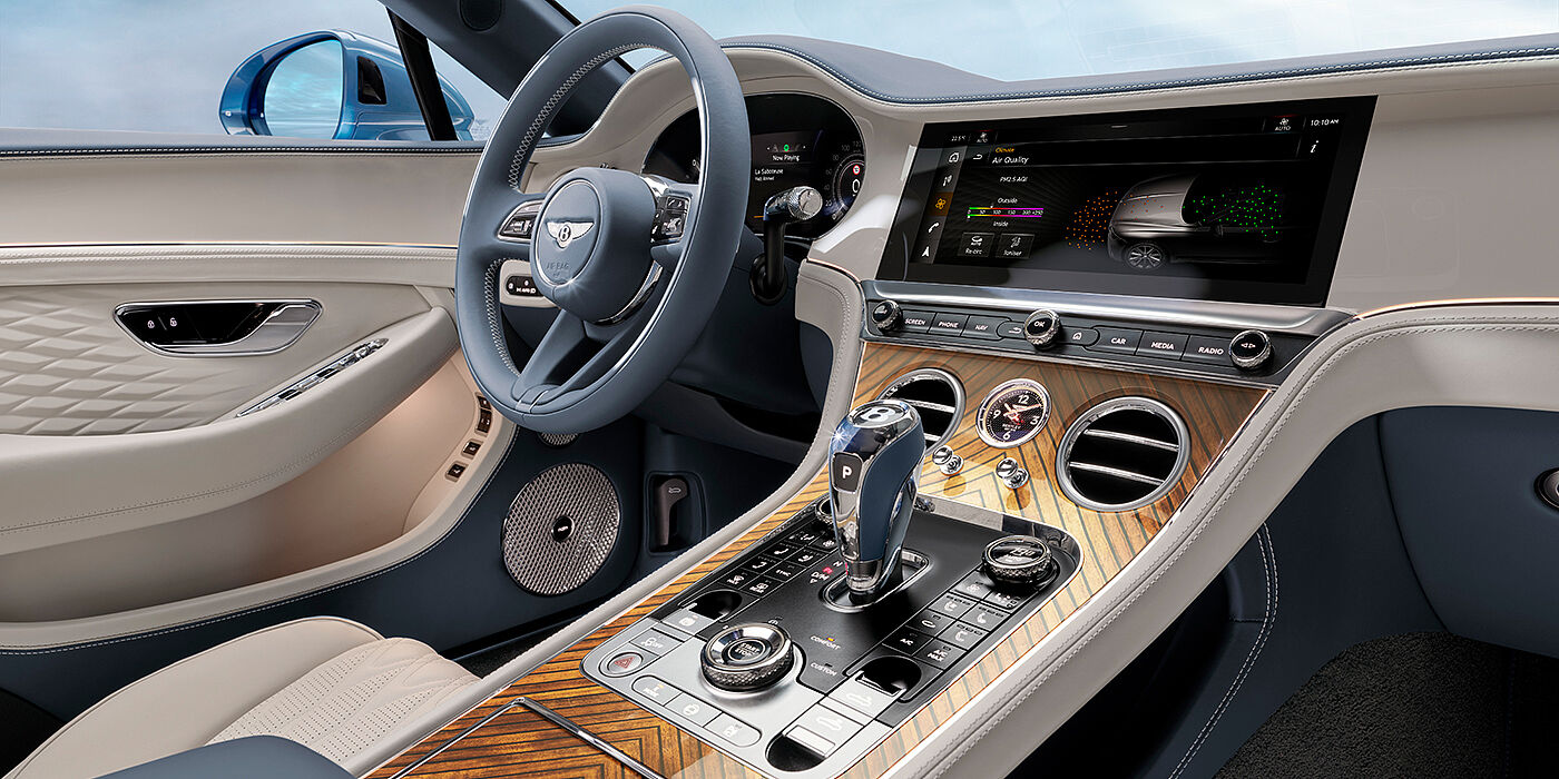 Emil Frey Exclusive Cars GmbH | Bentley München New Bentley Continental GTC Azure convertible interior front cabin view with Linen and Brunel hides and Piano Linen by Mulliner veneer featuring centre console and centre MMI screen