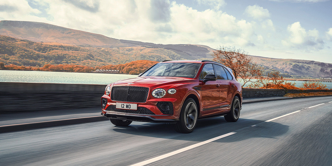Emil Frey Exclusive Cars GmbH | Bentley München Bentley Bentayga S SUV in Candy Red paint front 34 dynamic
