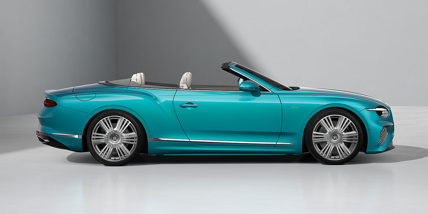 Emil Frey Exclusive Cars GmbH | Bentley München Bentley Continental GTC Azure convertible in Topaz Blue paint and 22" Azure wheels - profile