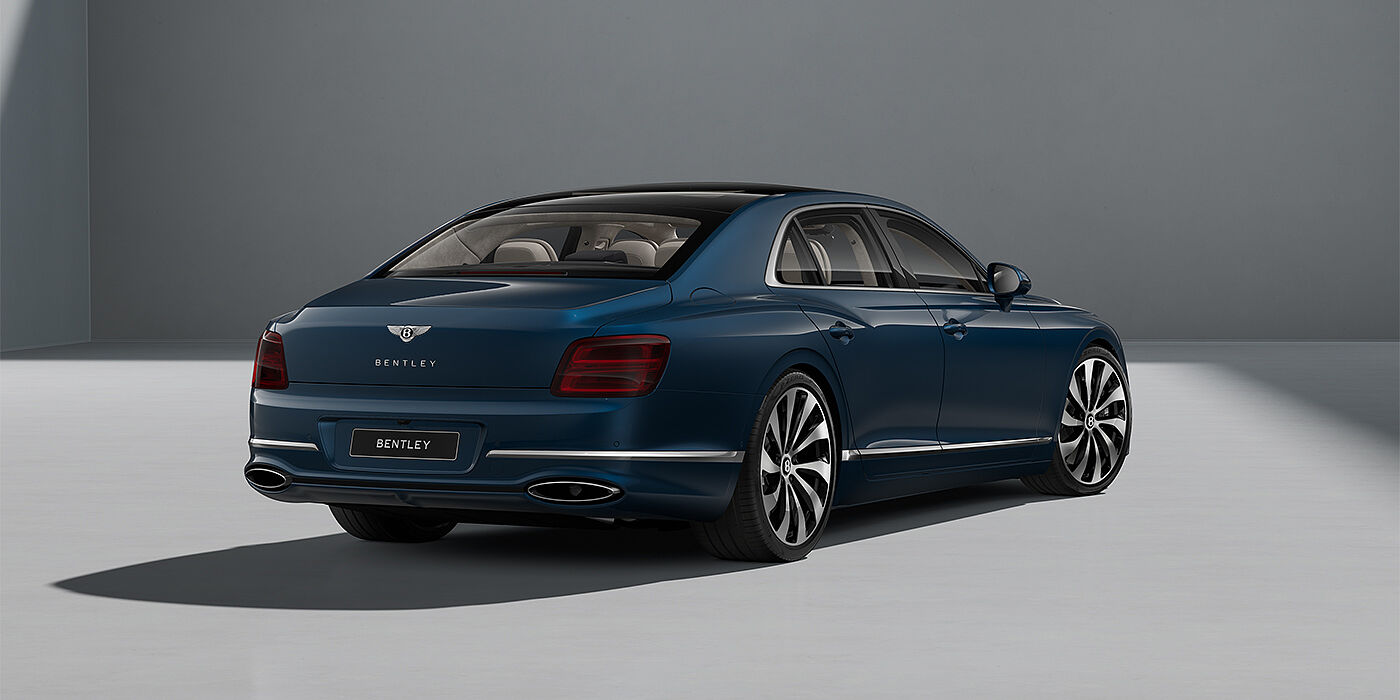 Emil Frey Exclusive Cars GmbH | Bentley München New Bentley Flying Spur sedan in Marlin blue paint rear 3/4 with 22" Ten Spoke Black Painted and Bright Machined wheels