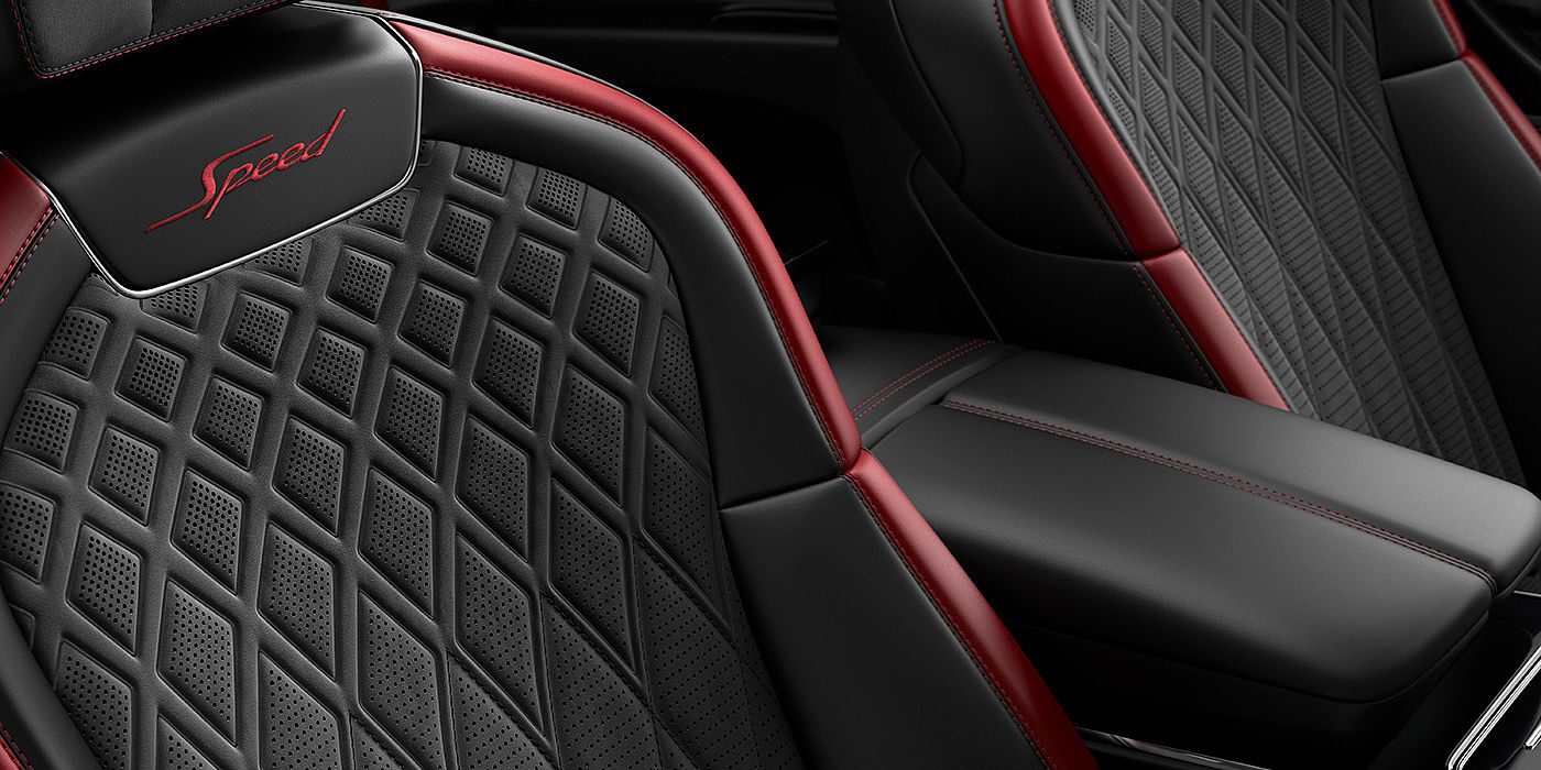Emil Frey Exclusive Cars GmbH | Bentley München Bentley Flying Spur Speed sedan seat stitching detail in Beluga black and Cricket Ball red hide