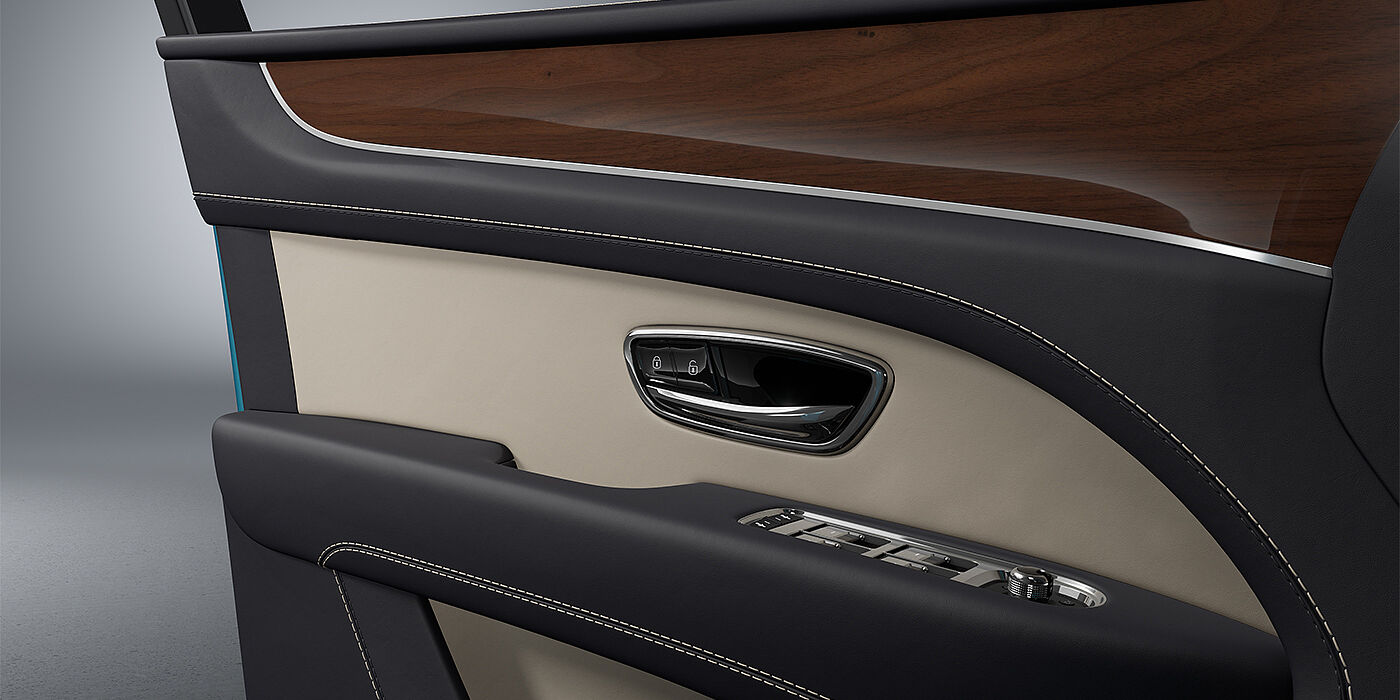 Emil Frey Exclusive Cars GmbH | Bentley München Bentley Bentayga EWB SUV door interior detail in Portland and Imperial Blue hides with Crown Cut Walnut veneer
