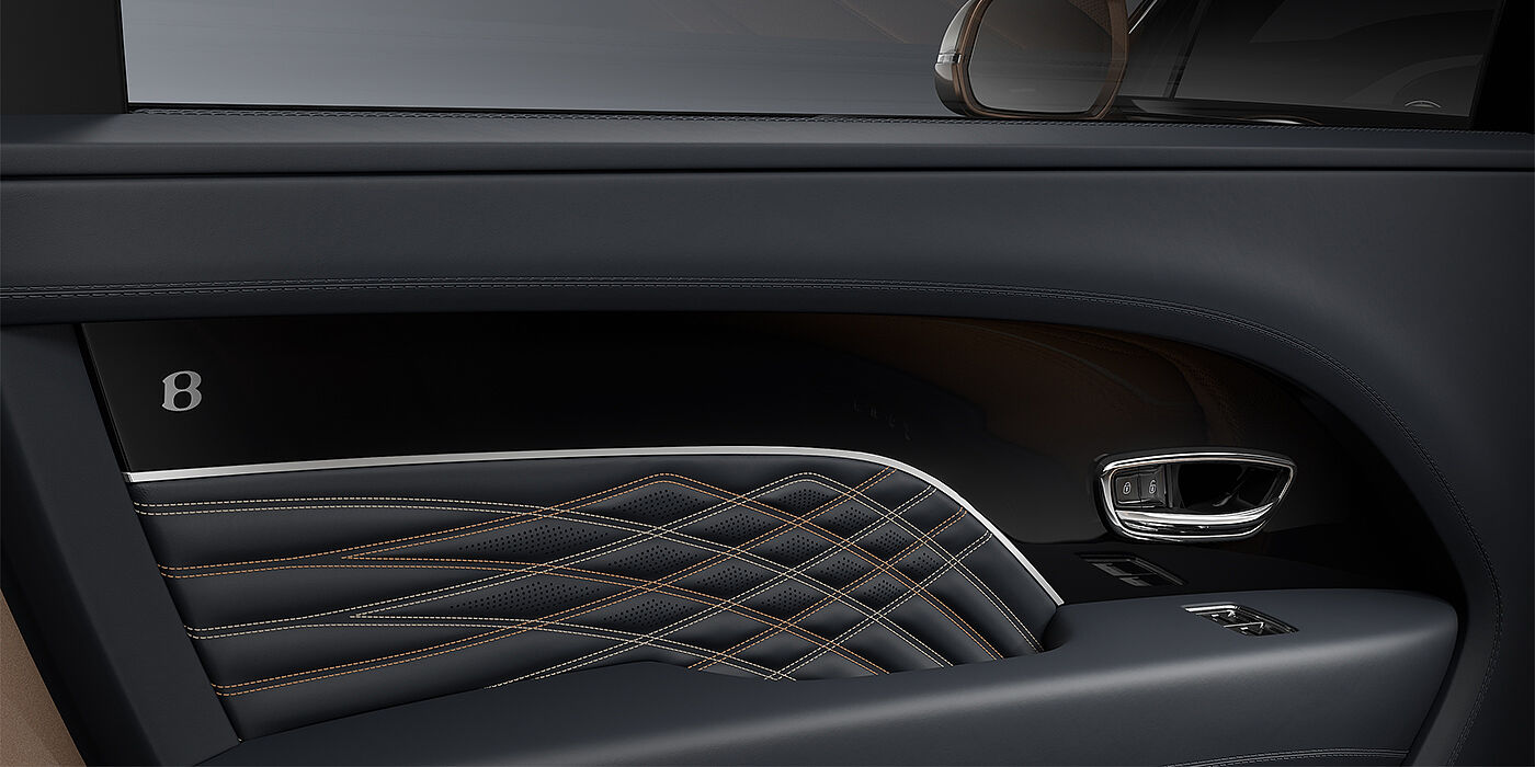 Emil Frey Exclusive Cars GmbH | Bentley München Bentley Bentayga EWB Mulliner SUV door interior detail in Brunel hide and Grand Black veneer with Mulliner contrast stitching