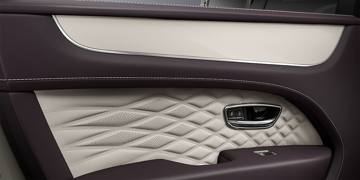Emil Frey Exclusive Cars GmbH | Bentley München Bentley Bentayga EWB Azure SUV door interior detail in Linen and Damson hides with Piano Linen veneer