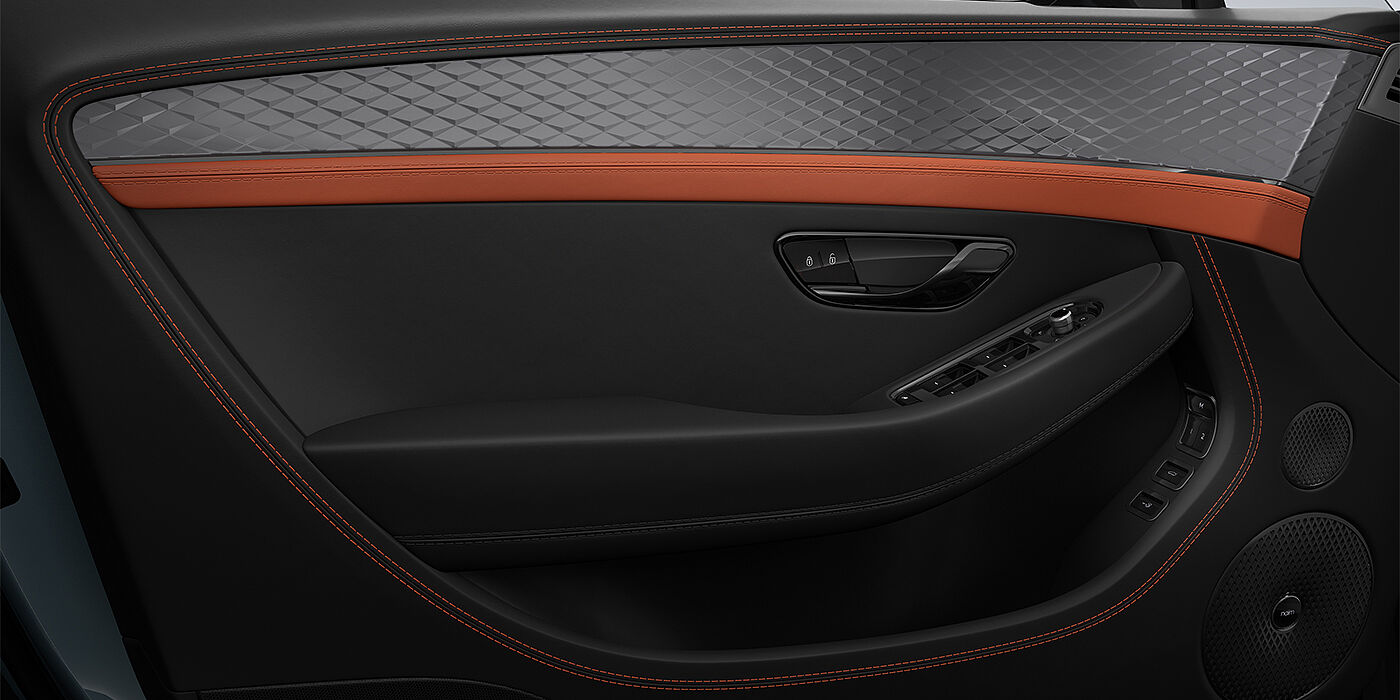 Emil Frey Exclusive Cars GmbH | Bentley München Bentley Continental GT coupe door interior detail in Newmarket Tan and Beluga black hides with Diamond Brushed Dark Tint Aluminium venee