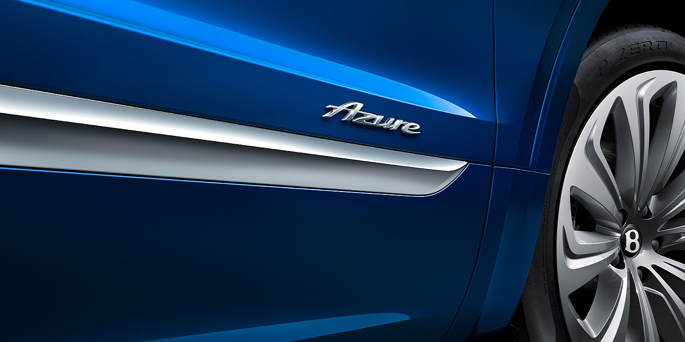Emil Frey Exclusive Cars GmbH | Bentley München Bentley Bentayga Azure SUV Sequin Blue paint with Azure badge close up