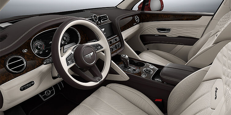 Emil Frey Exclusive Cars GmbH | Bentley München Bentley Bentayga EWB Azure SUV front interior in Linen and Burnt Oak hides with Dark Stained Burr Walnut veneer