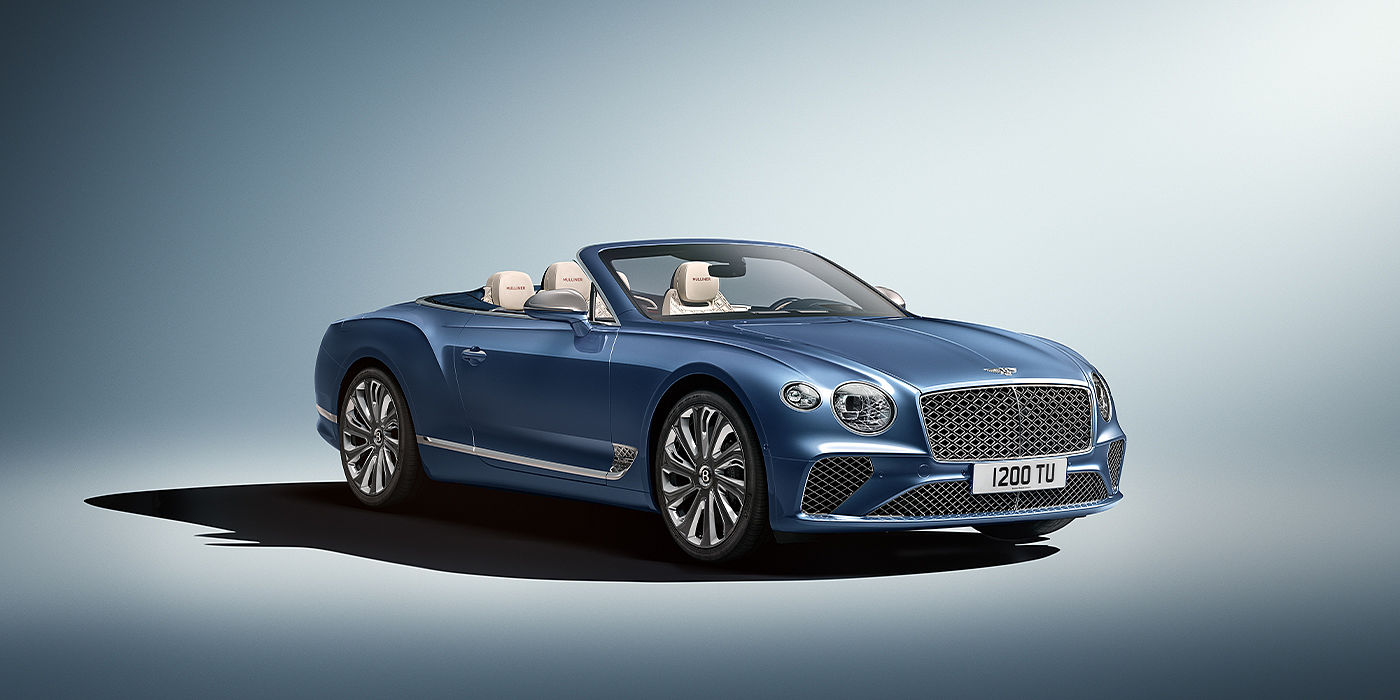 Emil Frey Exclusive Cars GmbH | Bentley München Bentley Continental GTC Mulliner convertible in Peacock blue paint front 34