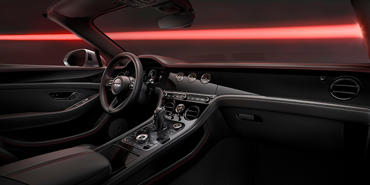Emil Frey Exclusive Cars GmbH | Bentley München Bentley Continental GTC Black Edition convertible front interior with Beluga black hide and High Gloss Carbon Fibre veneer