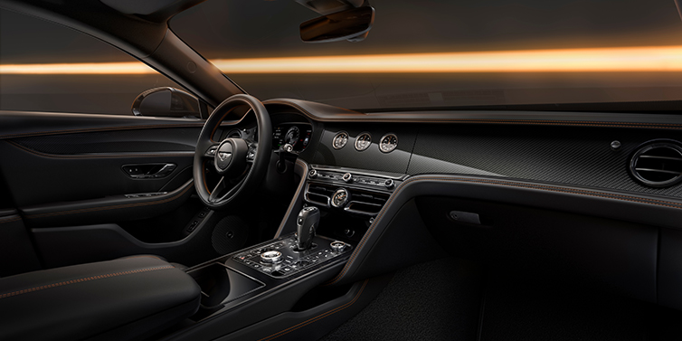 Emil Frey Exclusive Cars GmbH | Bentley München Bentley Flying Spur Black Edition sedan front interior in Beluga black hide with High Gloss Carbon Fibre veneer