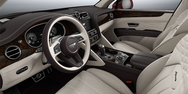 Emil Frey Exclusive Cars GmbH | Bentley München Bentley Bentayga EWB Azure SUV front interior in Linen and Burnt Oak hides with Dark Stained Burr Walnut veneer