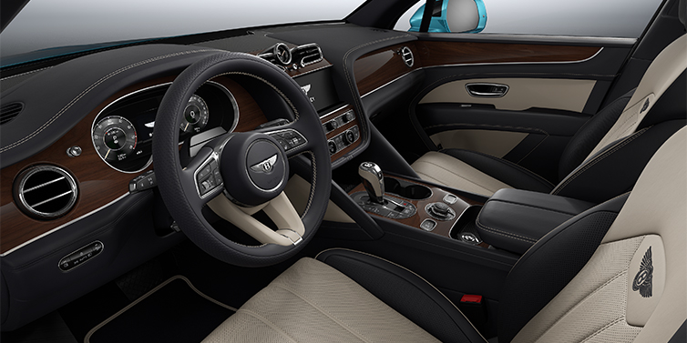 Emil Frey Exclusive Cars GmbH | Bentley München Bentley Bentayga EWB SUV front interior in Portland and Imperial Blue hides with Crown Cut Walnut veneer