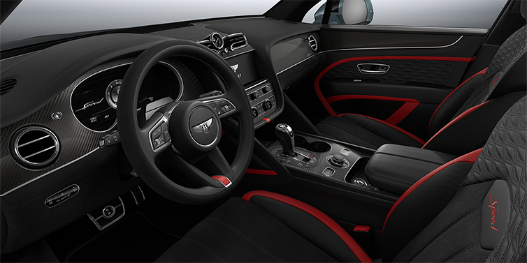 Emil Frey Exclusive Cars GmbH | Bentley München Bentley Bentayga Speed SUV front interior in Pillar Box Red and Beluga black hides with Carbon Fibre veneer