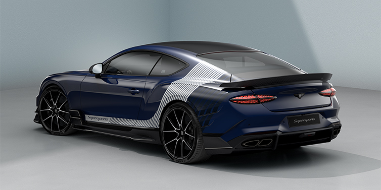 Emil Frey Exclusive Cars GmbH | Bentley München Bentley Supersports rear three quarter in "Skies" Design theme with Electric Blue paint finish and Arctica white and Oxford blue paint stripes across the rear haunch.