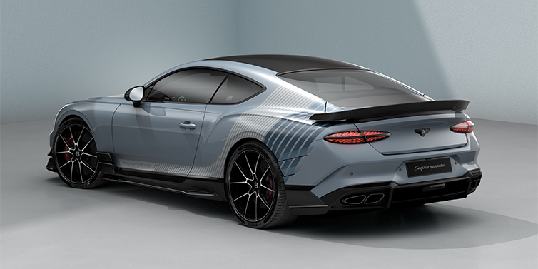 Emil Frey Exclusive Cars GmbH | Bentley München Bentley Supersports rear three quarter in "Daybreak" Design theme with Jetstream blue paint and Arctica white and Portofino blue paint stripes across the rear haunch.