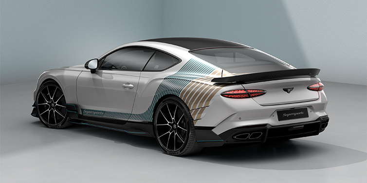 Emil Frey Exclusive Cars GmbH | Bentley München Bentley Supersports rear three quarter in "Snowstorm" Design theme with Snow Quartz paint and Topaz blue and Camel brown paint stripes across the rear haunch.