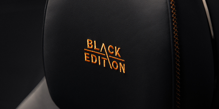 Emil Frey Exclusive Cars GmbH | Bentley München Bentley Continental GT coupe seat headrest Black Edition stitched emblem in Mandarin colour against Beluga black hide