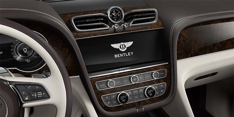 Emil Frey Exclusive Cars GmbH | Bentley München Bentley Bentayga EWB Azure SUV centre console detail showing Bentley Wings